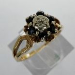 9ct gold cluster ring set with diamond and sapphires, size I/J, 2.4g. UK P&P Group 1 (£16+VAT for