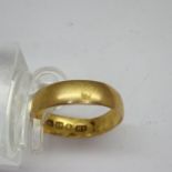 22ct gold band, size K, 2.1g, slightly misshapen. UK P&P Group 1 (£16+VAT for the first lot and £2+