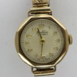 BENTIMA: 9ct gold cased ladies wristwatch on a gold plated expanding bracelet, not working at