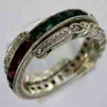 Antique white metal day/night ring set with garnet, emerald and cubic zirconia, missing two