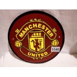 Cast iron Manchester United plaque. D: 25cm. UK P&P Group 1 (£16+VAT for the first lot and £2+VAT