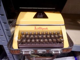 Lilliput mechanical type writer with key. Not available for in-house P&P