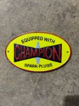Cast iron Champion Spark Plugs sign, W: 30 cm. P&P Group 1 (£14+VAT for the first lot and £1+VAT for