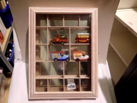 Mirror back wall mounted display case and four die cast cars. Not available for in-house P&P