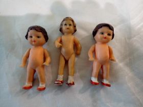 Three small vintage dolls, one marked Germany 7020, H: 80 mm, soft plastic jointed limbs. Two