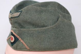 A German WWII Wehrmacht enlisted mans side cap. UK P&P Group 2 (£20+VAT for the first lot and £4+VAT