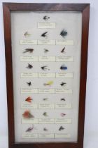 A display of twenty-two annotated trout flies. UK P&P Group 3 (£30+VAT for the first lot and £8+