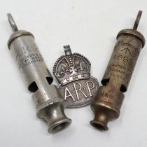 A British Home Front ARP whistle by Hudson & Co, a hallmarked silver ARP buttonhole and an 1899