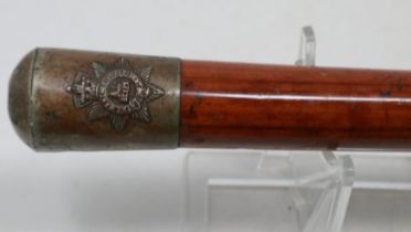 A WWI-II Manchester Regiment parade stick, with silver plated pommel and ferrule on a Malacca shaft.