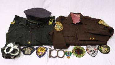 US Police mixed uniform and equipment, including Oklahoma State shirt, handcuffs and Police &