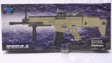 New old stock spring powered 6mm BB rifle in tan (FN Scar style), unopened. UK P&P Group 3 (£30+