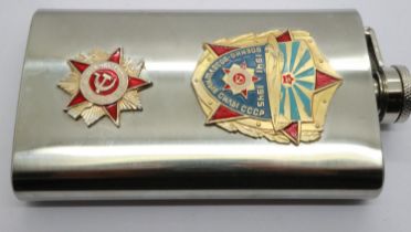 A Soviet WWII commemorative steel flask, surmounted with two enamelled badges. UK P&P Group 1 (£16+