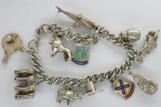 Hallmarked silver charm bracelet with eleven charms, L: 19 cm, 41g. UK P&P Group 1 (£16+VAT for