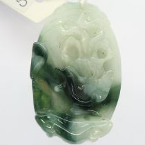 Unusual carved jade pendant, H: 45 mm. UK P&P Group 1 (£16+VAT for the first lot and £2+VAT for