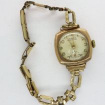 9ct gold cased ladies wristwatch on a 1/10th 12ct rolled gold bracelet, not working at lotting. UK