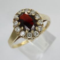 9ct gold cluster ring set with garnet and cubic zirconia, size Q/R, 2.4g. UK P&P Group 0 (£6+VAT for