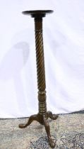 Mahogany torchere with carved twist stem on carved tripod supports, H: 140 cm. Not available for