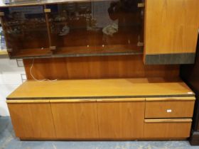 McIntosh teak sideboard with floating display cabinet above, 180 x 52 x 140 cm H. Not available