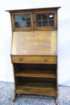 Oak bureau bookcase comprising lead glass top, fitted interior and bookshelves below, 69 x 46 x