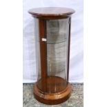 Modern mahogany cylindrical display with glass door and two glass shelves, H: 88 cm.