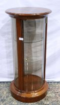 Modern mahogany cylindrical display with glass door and two glass shelves, H: 88 cm.