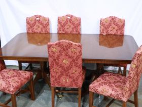 Twin pedestal dining table with three additional leaves and six mahogany upholstered chairs, 200 x