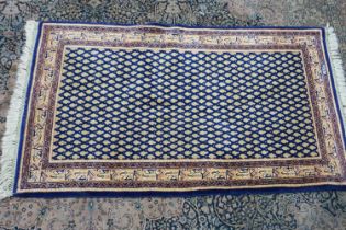 Woolen blue ground middle Eastern rug, 90 x 170 cm. Not available for in-house P&P