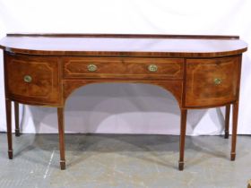 A 19th century mahogany buffet sideboard on six tapering supports with boxwood banding, central