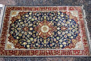 Middle eastern red and blue ground silk rug, 160 x 100 cm. Not available for in-house P&P