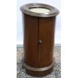 A 19th century Irish cylindrical pot cupboard with marble top for restoration. Not available for