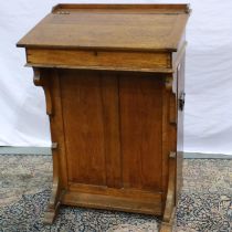 Oak lift top clerks desk/lectern with steel carry handles and cupboard to back, 52 x 72 x 103 cm.