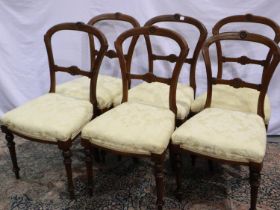 A set of six Victorian walnut framed dining chairs with later re-upholstered seat not available