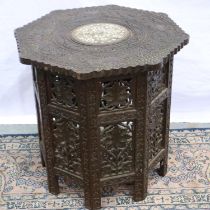 Highly carved octagonal Indian side table with bone inlay decoration, 46 x 46 x 46 cm. Not available