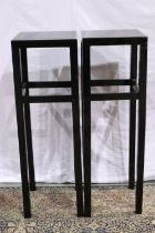 A pair of large black lacquered pedestals. Not available for in-house P&P