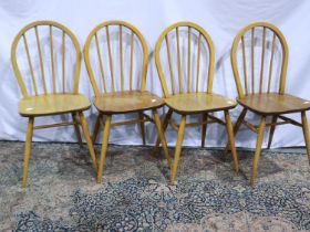 A set of four Ercol elm seated stickback chairs. Not available for in-house P&P