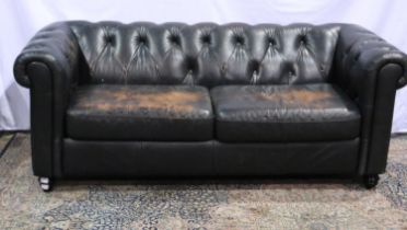 Large dark brown leather button back Chesterfield settee with faults, L: 200 cm. Not available for