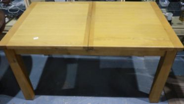 Modern oak extending dining table on square supports. Not available for in-house P&P
