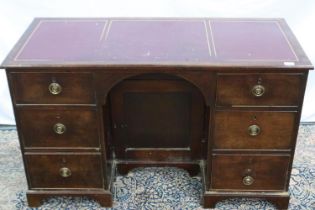 A George III twin pedestal kneehole writing desk of six drawers and central cupboard, 125 x 56 x