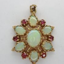 9ct gold pendant set with opals and rubies, H: 35 mm, 4.2g. UK P&P Group 1 (£16+VAT for the first