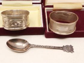 Two hallmarked silver napkin rings and a spoon, combined 38g. UK P&P Group 1 (£16+VAT for the