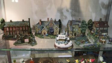 Nine pieces of Thomas Kinkade including village buildings., largest H: 17 cm. Not available for in-