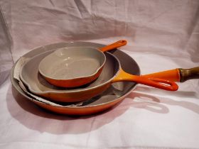 Set of three orange Le Creuset frying pans. Not available for in-house P&P