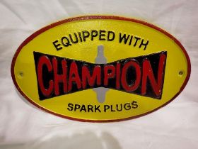 Cast iron Champion Spark Plugs sign, W: 30 cm. P&P Group 1 (£14+VAT for the first lot and £1+VAT for