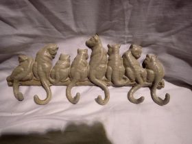 Cast iron cat tail coat hook, L: 36 cm. UK P&P Group 2 (£20+VAT for the first lot and £4+VAT for