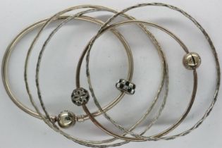 Three white metal bangles and two sterling silver examples, largest D: 70 mm. UK P&P Group 1 (£16+