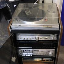 Sony stereo turntable system, model PS-T22, with a Sony and Sherwood stacking system in a wooden