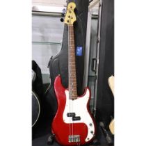 Fender Precision bass guitar in red, numbered N 59436, 1990s, with fitted hard case. Not available