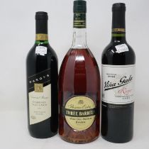 1L bottle of Three Barrels brandy and two bottles of wine. Not available for in-house P&P