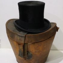 Woodrow (Liverpool) black silk top hat, approximate size 718, within a fitted leather hat box, front