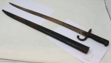 French 19th century chassepot sword bayonet with metal scabbard and hooked quillon, dated 1868. UK